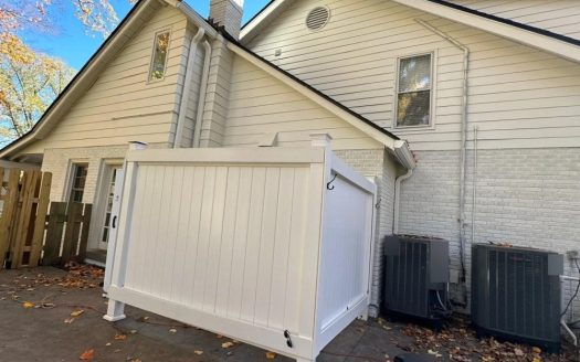 Home exterior with fresh low-sheen paint on siding and painted brick