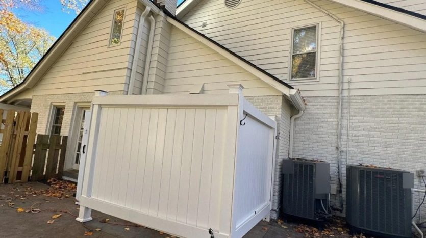 Home exterior with fresh low-sheen paint on siding and painted brick